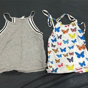 gray halter top is a medium. blue butterfly halter top is a small